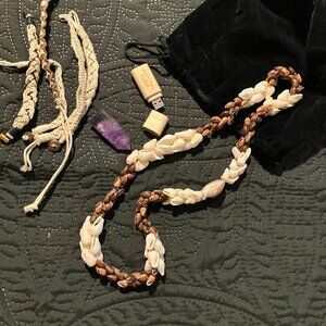 Hawaiian Puka necklace, 5 bracelets, a purple crystal, and a thumb drive